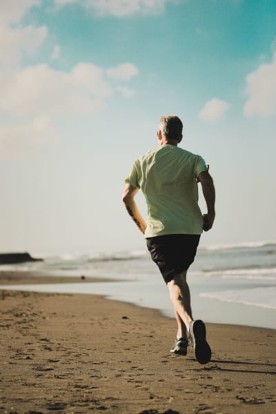 Man running on beach - Heart Care 